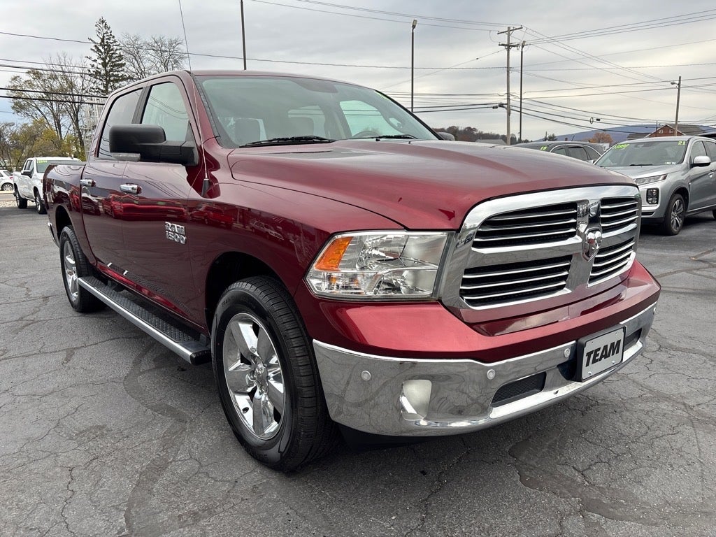 2017 RAM 1500 Big Horn Crew Cab 4x4 5'7" Box in Red — front three-quarter view