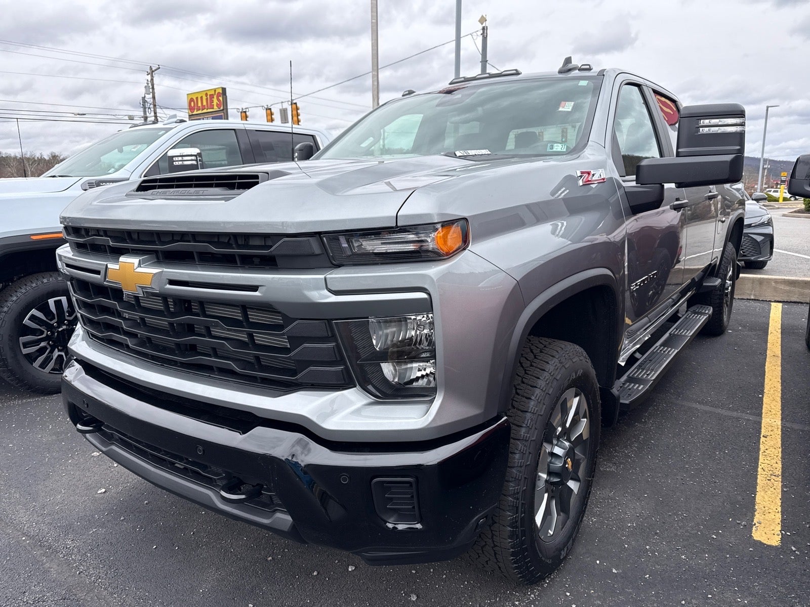 2026 Chevrolet Silverado 2500 HD Custom in Sterling Gray Metallic — front three-quarter view