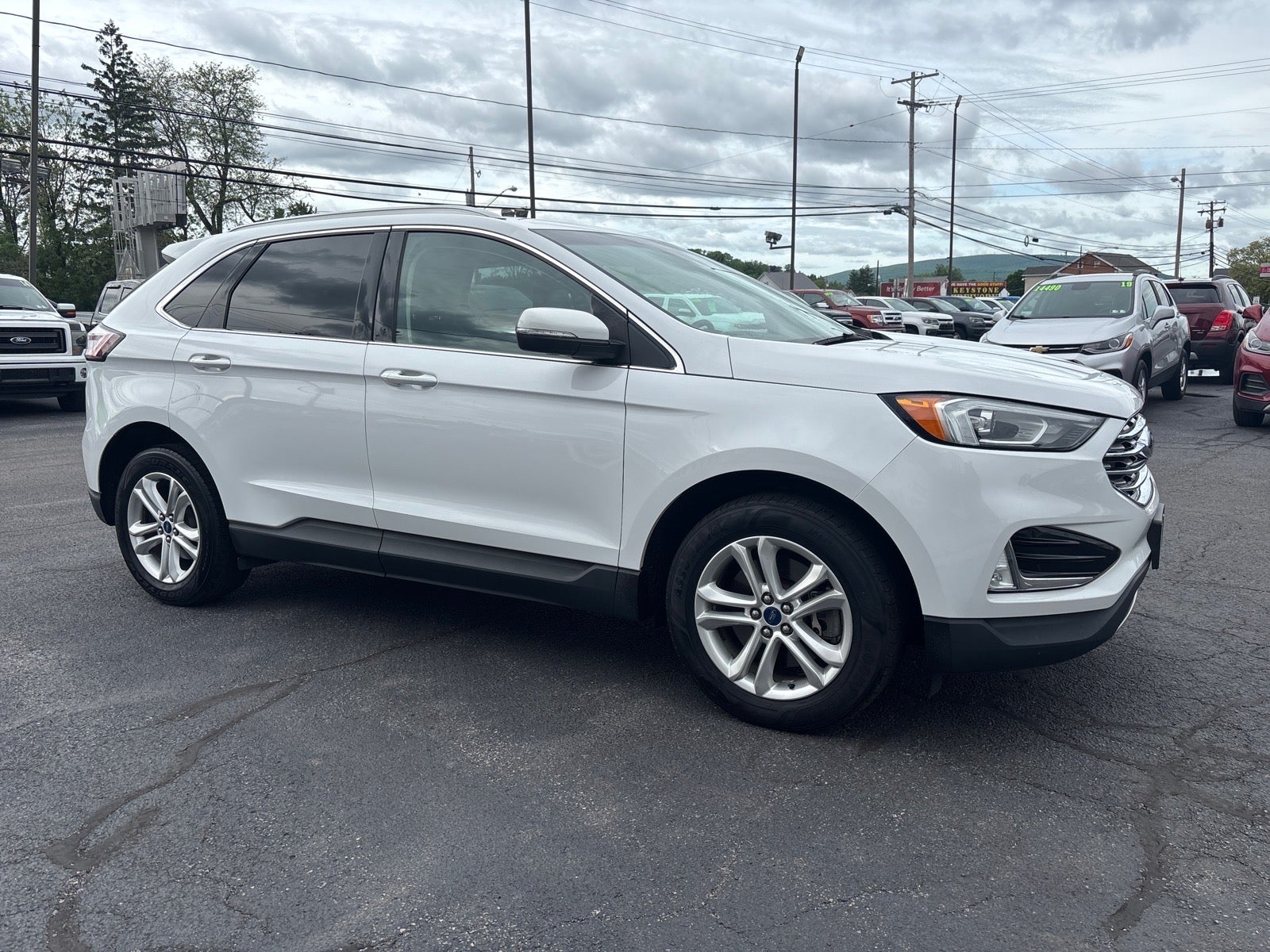 2019 Ford Edge SEL in White — front three-quarter view